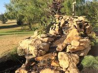 Built-up rock waterfall in a flower bed, Chambersburg, Pennsylvania